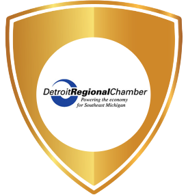 Red ribbon award in a circular rosette shape with the Detroit Regional Chamber logo at the center, symbolizing recognition for supporting minority suppliers and promoting diversity in business.