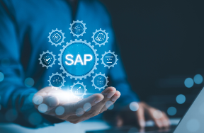 Person holding out their hand displaying a glowing digital interface with the 'SAP' acronym and interconnected gear icons, symbolizing enterprise resource planning and business management in a high-tech environment.