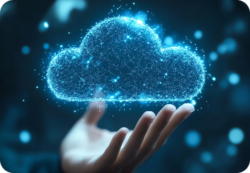 Hand holding a glowing digital cloud made of shimmering particles against a dark background, symbolizing technology and cloud computing.